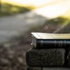 Holy Bible on black wooden bench